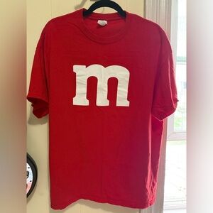 Red T-Shirt with bold white “m” (M&M chocolate) printed on Gildan brand t-shirt.